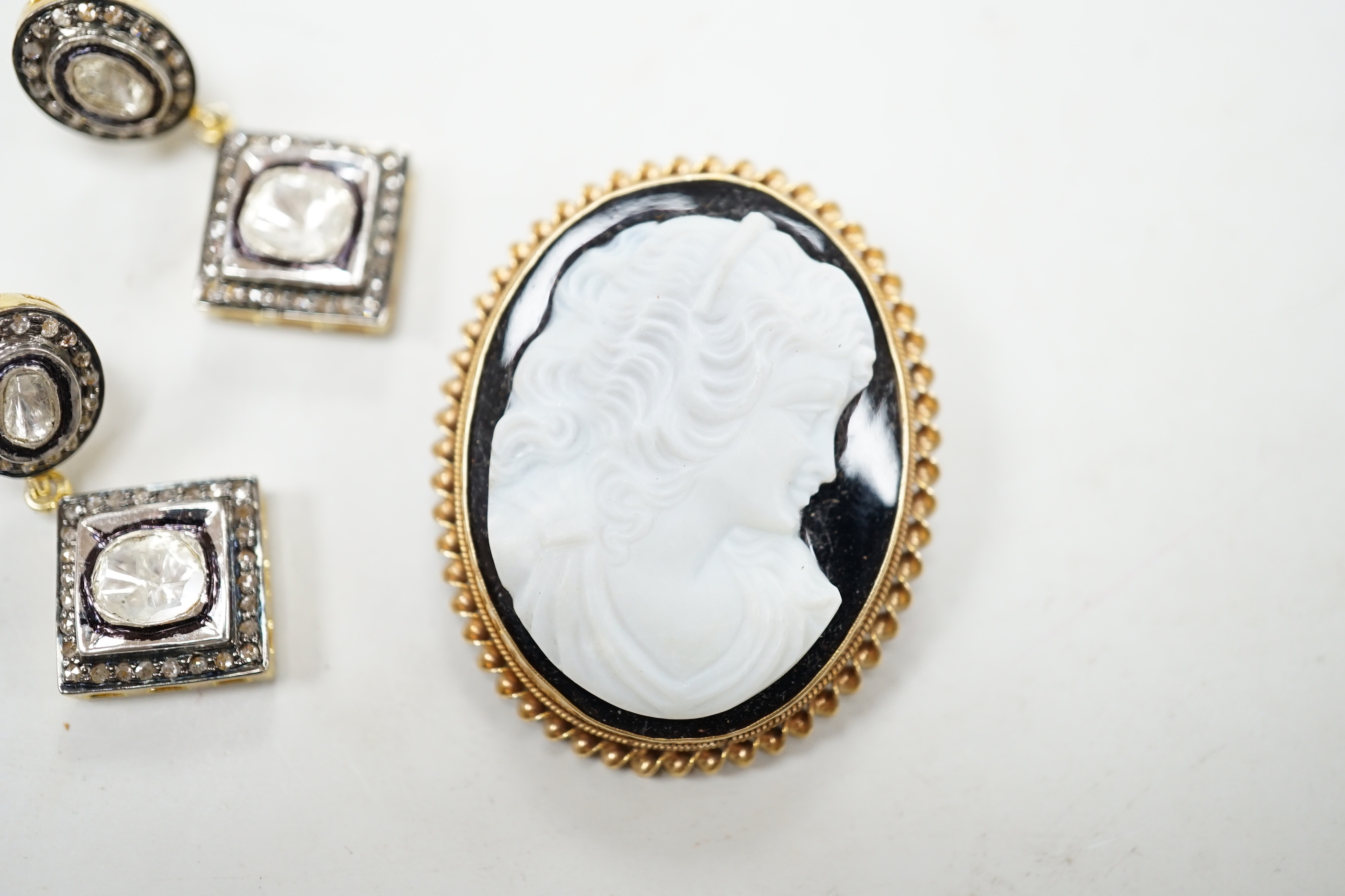 A modern 9ct gold mounted oval cameo hardstone brooch, 40mm and a pair of gilt 925 and diamond set drop earrings.